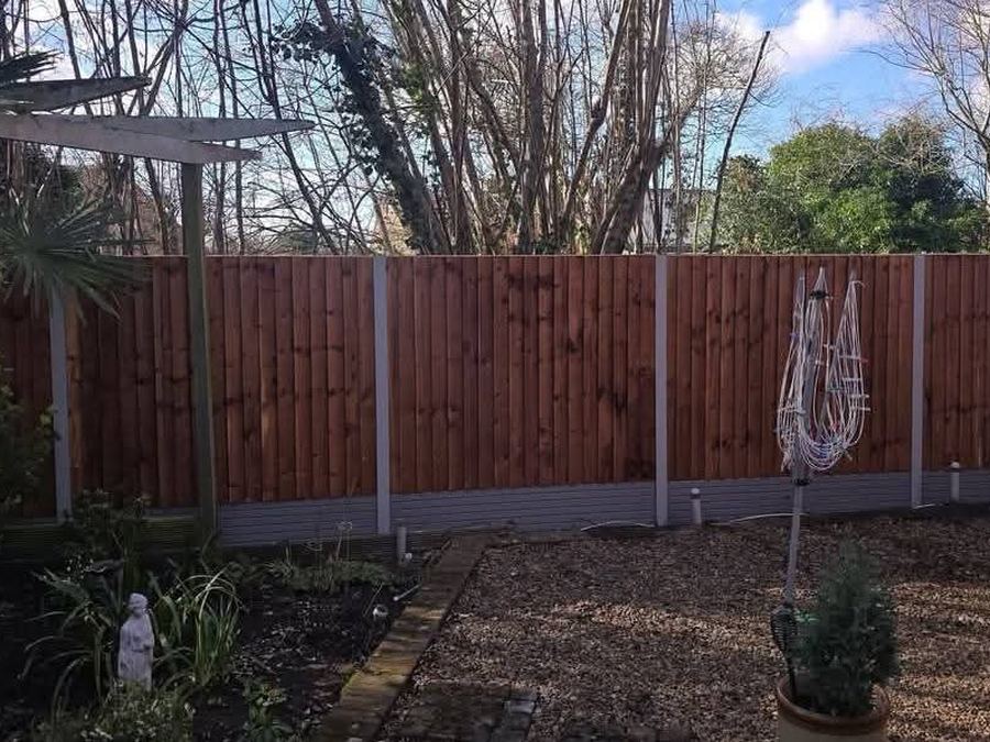 Closeboard fencing with concrete posts and gravel boards