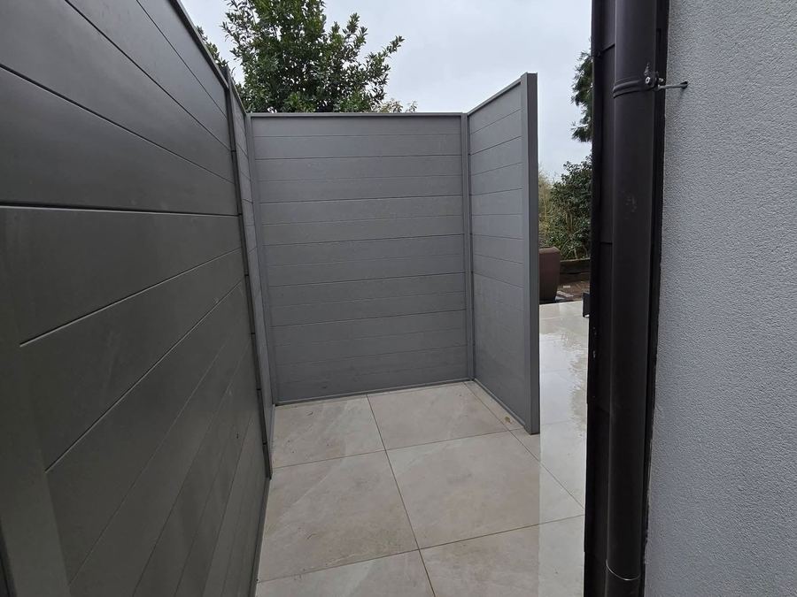 Grey composite fencing on a new patio
