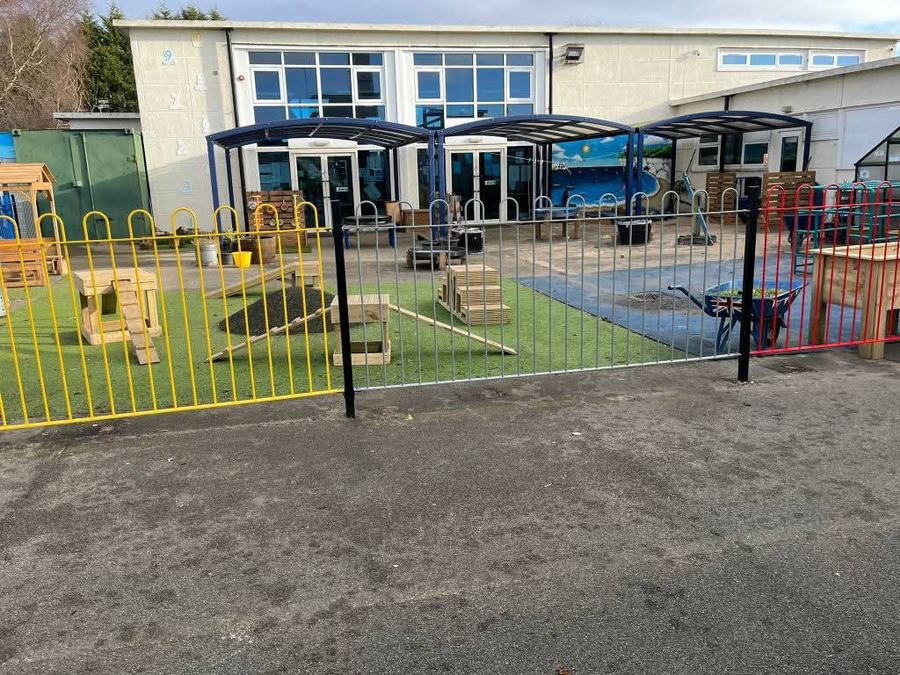 Bow-top railings around a school playground